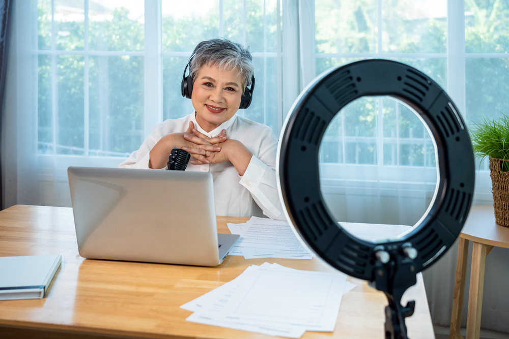 Senior,Influencer,Asian,Woman,Using,Ring,Light,And,Microphone,For